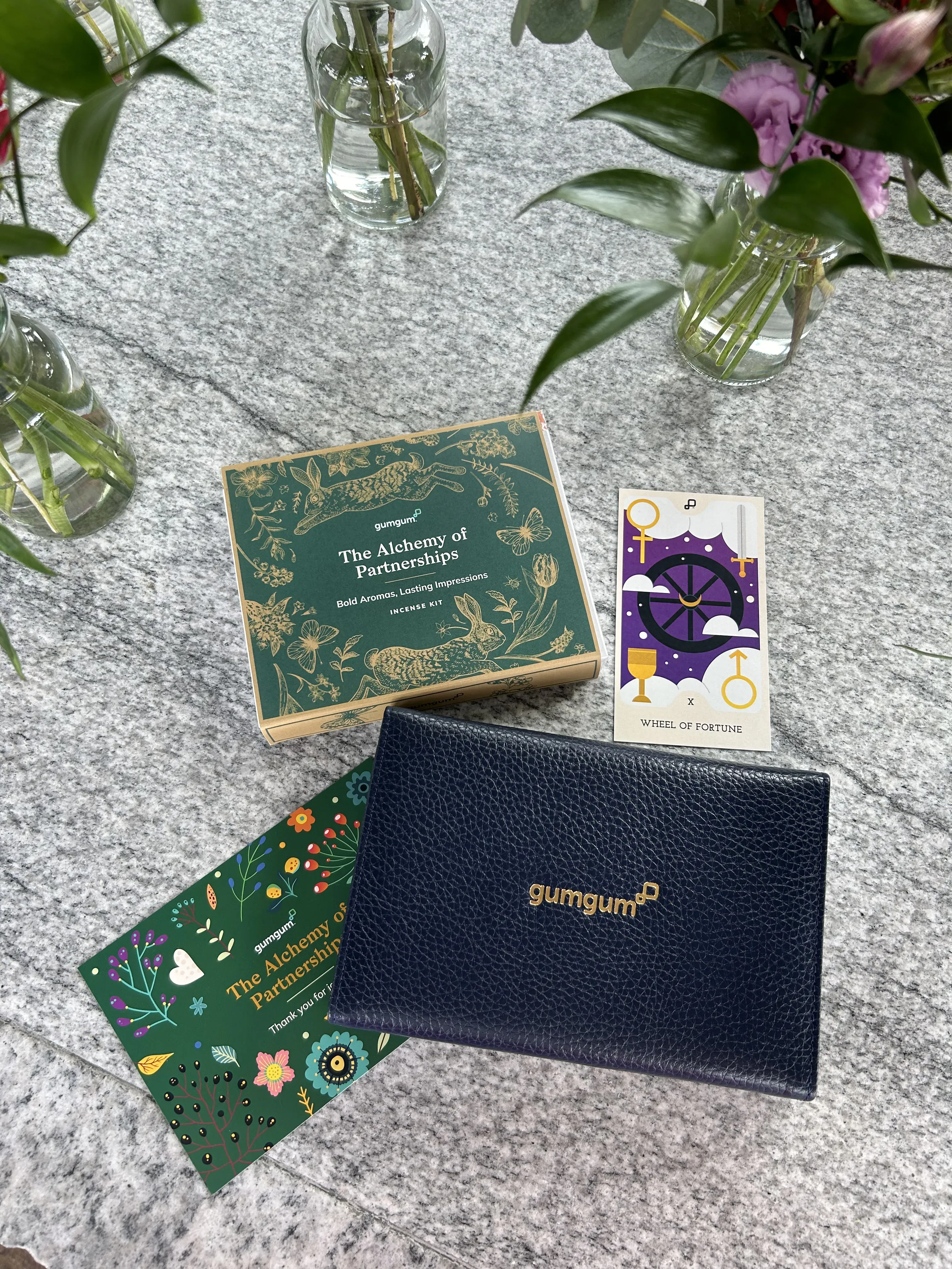 The giftbox, tarot card, notebook and thank you card that the clients received